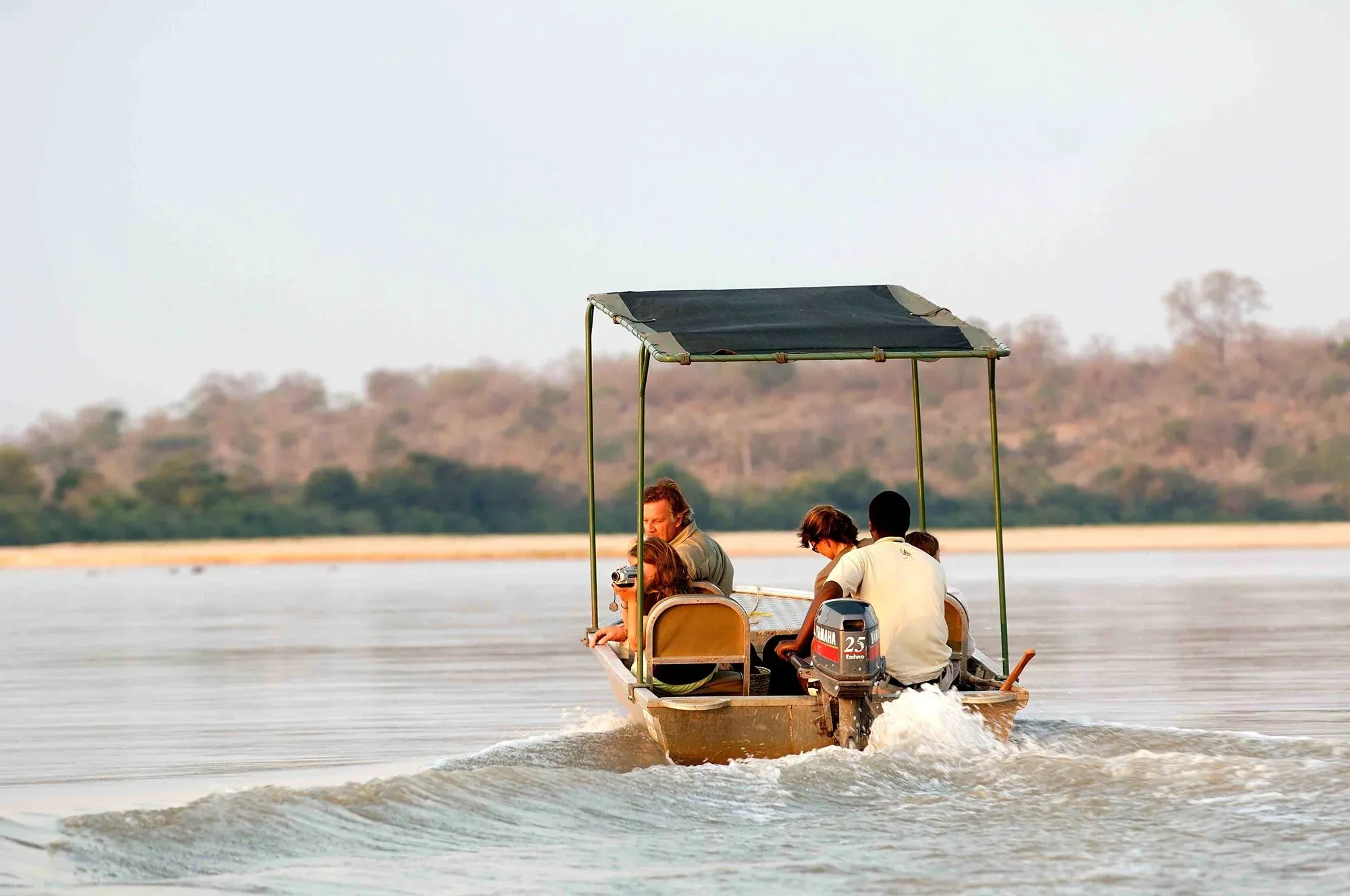 A boat safari gliding down the Rufiji River in the Selous Game Reserve, Tanzania