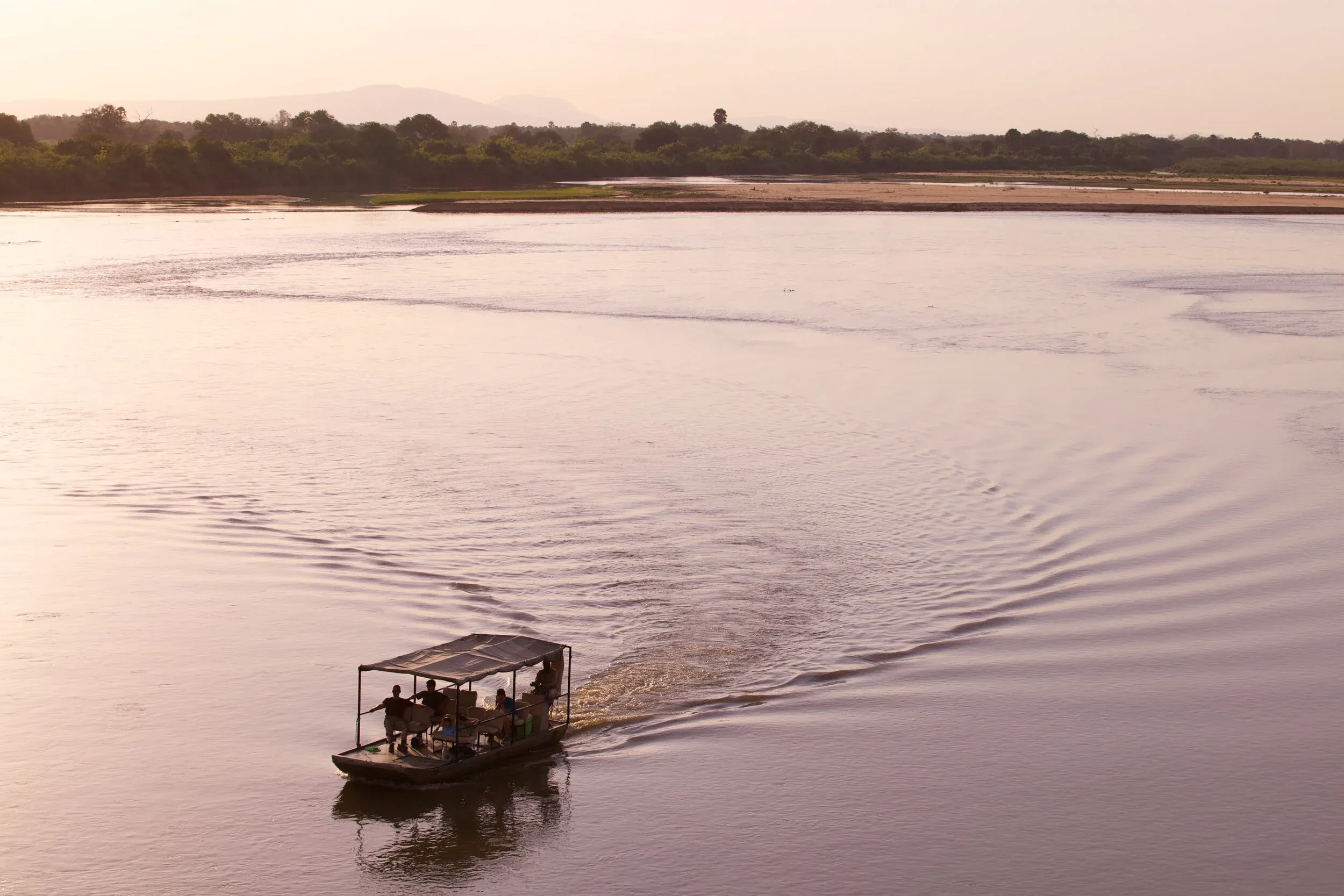 A boat safari gliding down the Rufiji River in the Selous Game Reserve, Tanzania