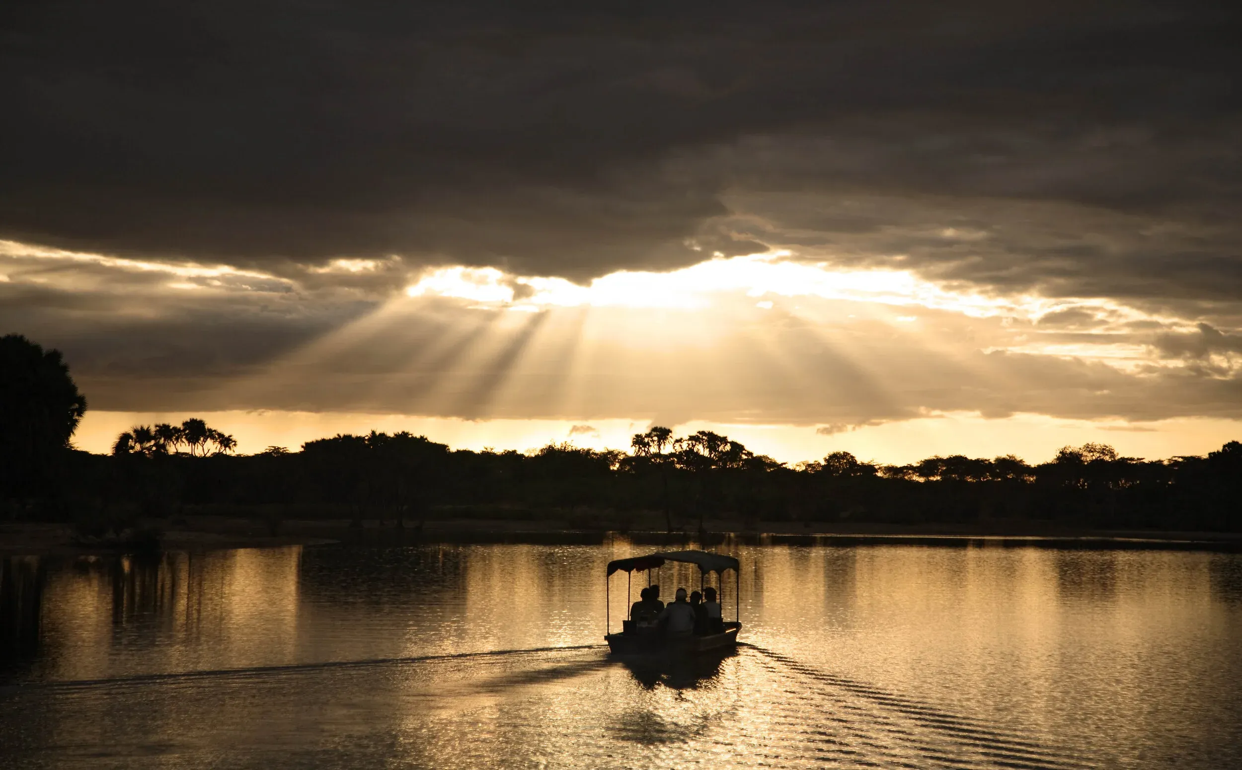 A boat safari gliding down the Rufiji River in the Selous Game Reserve, Tanzania